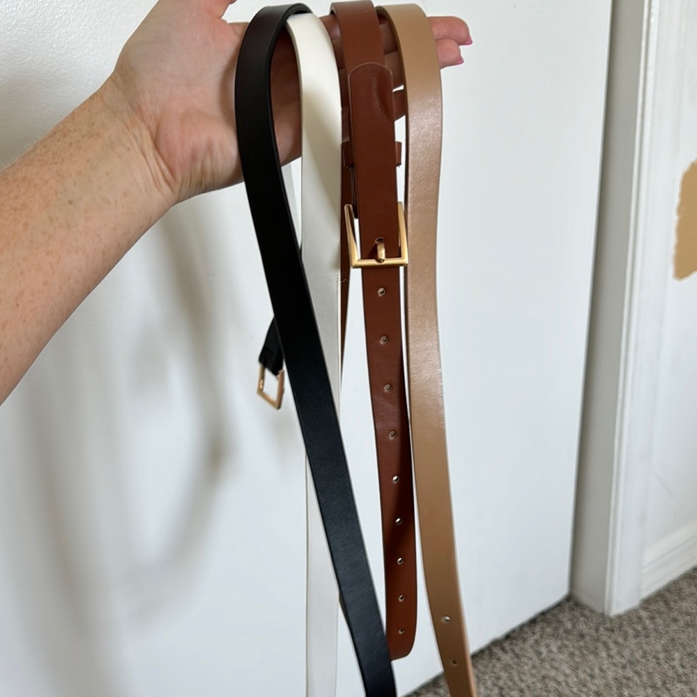 Black, White, and Brown Leather Belts